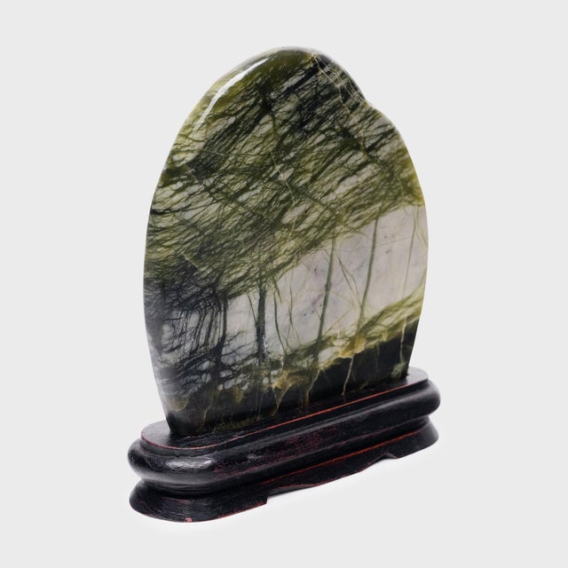 A well-chosen stone is a resting place for the mind, inspiring calm and contemplation. Marked by currents of jadeite, moss...