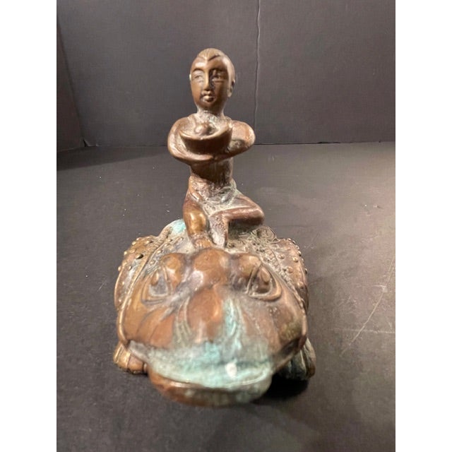 A statue of Tao wealth god Liu Hai, astride his golden toad, dating to the late Ming/early Qing Dynasty. A finely-crafted...