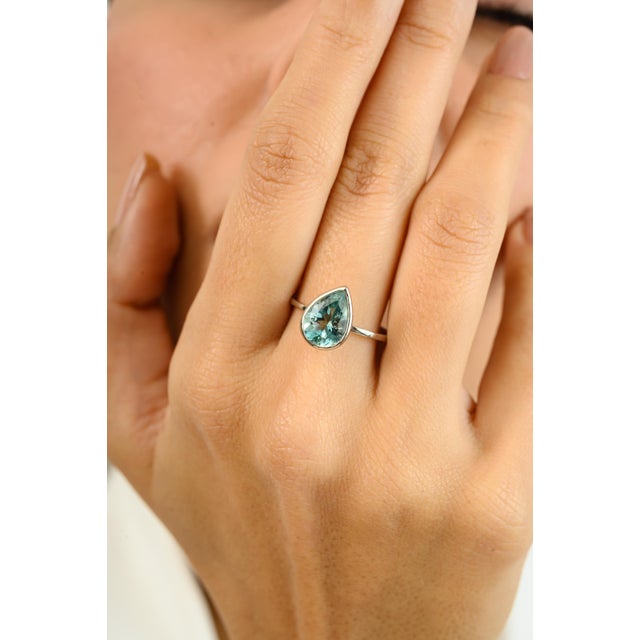1.62 CTW Certified Natural Solitaire Pear Aquamarine Ring in 14k White Gold featuring natural aquamarine of 1.62 carats....