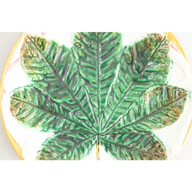 A fine antique 19th-Century George Jones majolica chestnut leaf on a white folded napkin plate, made in England, circa...