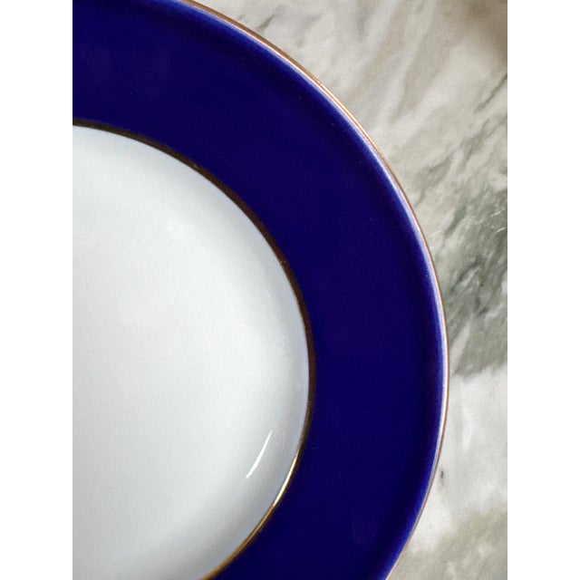In Lomonosov's quintessential vibrant violet cobalt blue rim, gold trim & verge all on white porcelain, here is a set of...