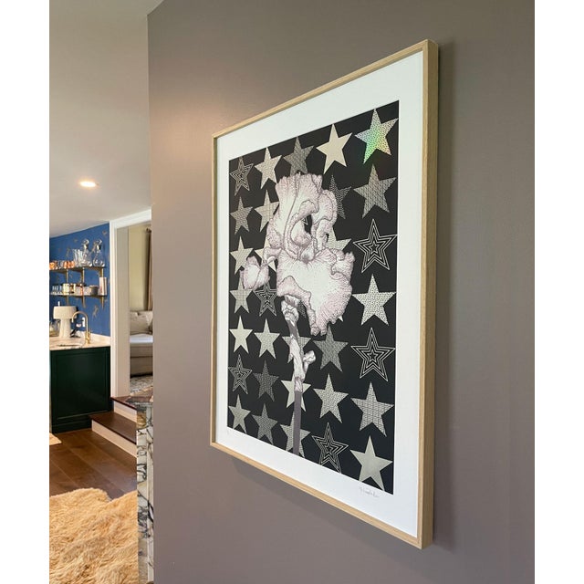 A delicate iris stands proud against a starry background Matt Black, metallic gold, mauve pink, eggplant Limited edition...