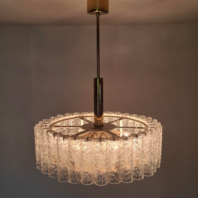 This high quality chandelier was manufactured in the 1960s by the renowned German company Doria. The chandelier consists...