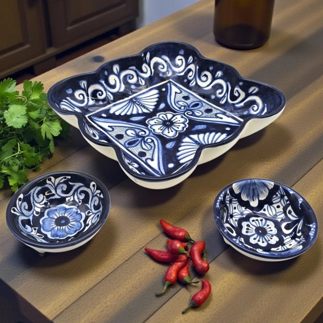 A hand-painted three-piece Talavera pottery serving set executed in traditional cobalt blue on cream earthenware,...