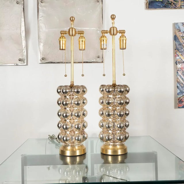 Pair of cylindrical lamps with mercury bubble glass body. Color varies slightly between pairs.