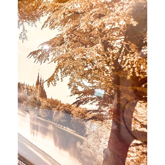 This image is a framed photograph of Frederiksborg Castle in Hillerød, Denmark. Built in the early 17th century by King...