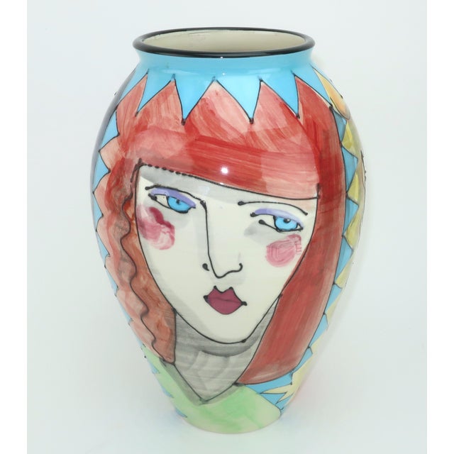 Tall, slender and elegant with a definitive 1980's vibe...this Denise Ford hand painted ceramic vase is decorated with the...
