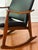 Elegant vintage Midcentury rocking chair in the style of Milo Baughman. This comfortable rocker features a solid wood...