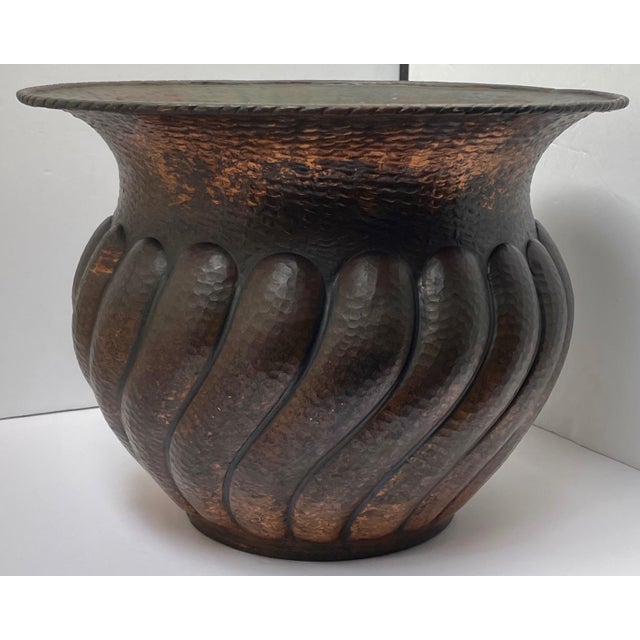Hand-forged copper planter with hammered texture and repousse fluted design. Warm patina adds timeless charm. Perfect...