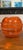 Striking vintage art glass bowl in a vivid translucent orange hue, featuring a sculptural rounded form with elegant ribbed...