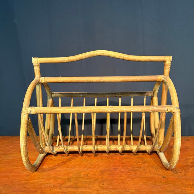 Elegant&nbsp;antique bent rattan and cane magazine rack with a beautifully crafted open framework, graceful curved lines...