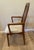 Single vintage Danish MCM style "captains" dining chair by Benny Linden, with arms. This chair is made of solid teak with...