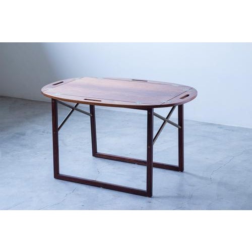 Side table so called "butlers tray" designed by svend langkilde. Produced in denmark by langkilde møbler during the 1950s....