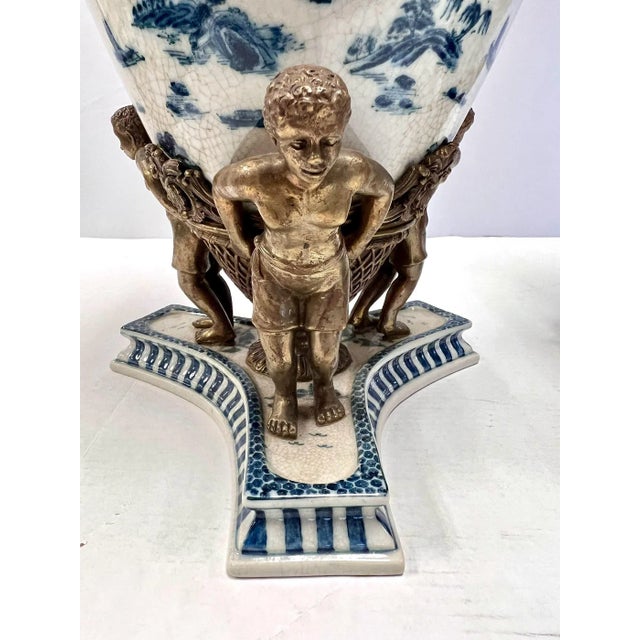 Exquisite pair of 20th century chinoiserie Hand Painted blue and white antique style porcelain vases with bronze ormolu...