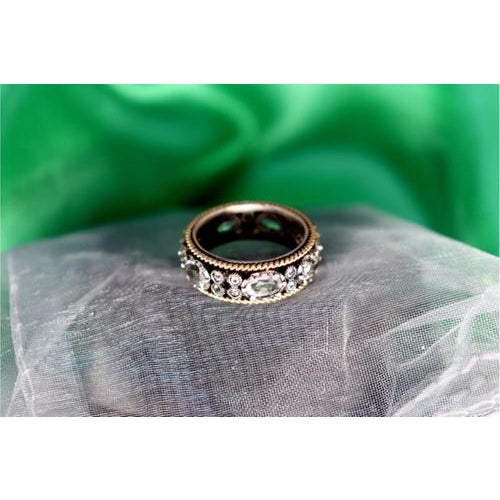 Gold and Silver Ring with Calibrated Zirconias, in Very Good conditions. Designed 1980 to 1989 This piece has an...