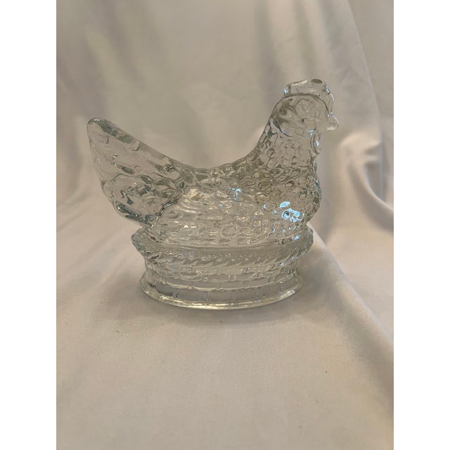 Clear hen from the 1940s created by the J H Millstein Co. It is made of pressed glass.