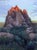 Sage by Judd Mercer | Oil Painting of a hiker near a rocky formation at sunset For Sale