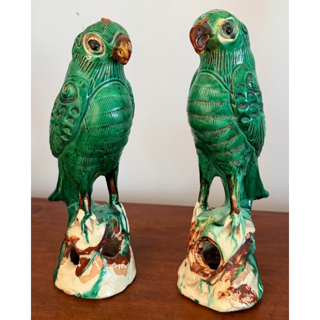 Pair of iconic Chinese export ceramic parrots wonderfully glazed from the early 1900s. Highly collectible and decorative,...