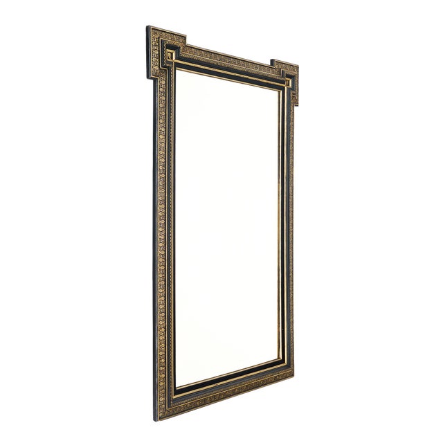 Napoleon III period mirror from France. This piece has a wooden frame with chiseled frame with gold leaf detailing...