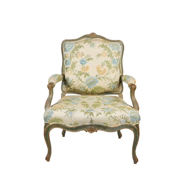 A hand-carved, period Louis XV armchair, hand-painted in a beautiful shade of green, covered in newer Italian, Coraggio...