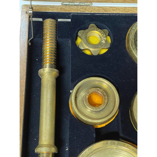 A limited edited Ivanko weight set plated in 22-karat gold made in a limited run in the early 1980s. There are four...