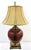 Pair of Uttermost Daviel Oxblood Red Porcelain and Coffee Bronze Stepped Base Table Lamps Style 26728 These lamps have a...