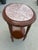 Elegant vintage oval side table featuring a beautiful pink-toned marble top set over a richly finished wood base. Designed...