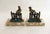 Pair of Art Deco bookends: small parrot sculptures perched on a fence/palisade (in spelter with a black and gold patina),...