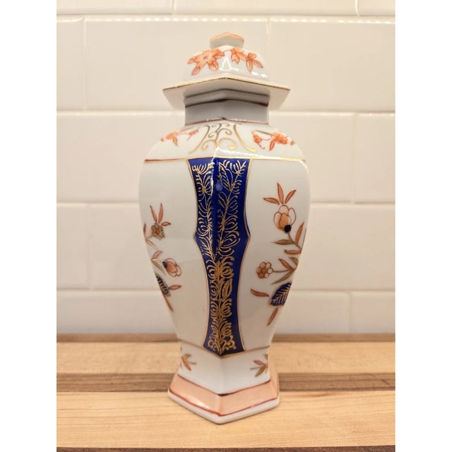 8 Inches Tall This exquisite Japanese porcelain vase is a true work of art. Hand-painted with precision and care, it...