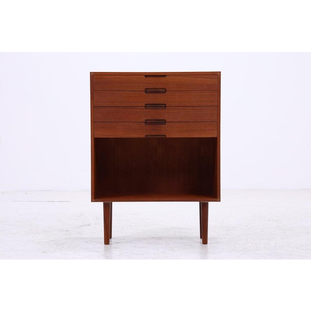 Vintage chest of drawers from the 1960s with five drawers and a spacious open compartment. Its simple design, warm-grained...