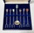 A beautifully handcrafted vintage cocktail pick set featuring six twisted silver-plated hors d'oeuvre picks, each topped...