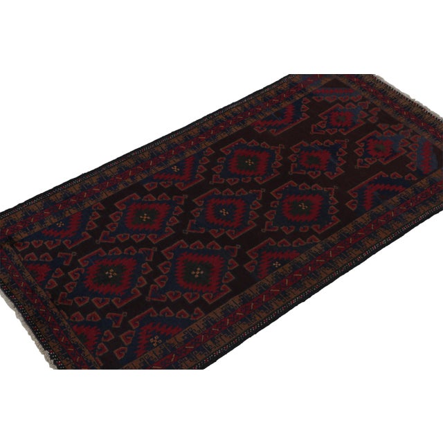 Hand knotted in wool, this 3x6 Baluch runner rug represents a new line of tribal carpets in the Modern Classics Collection...