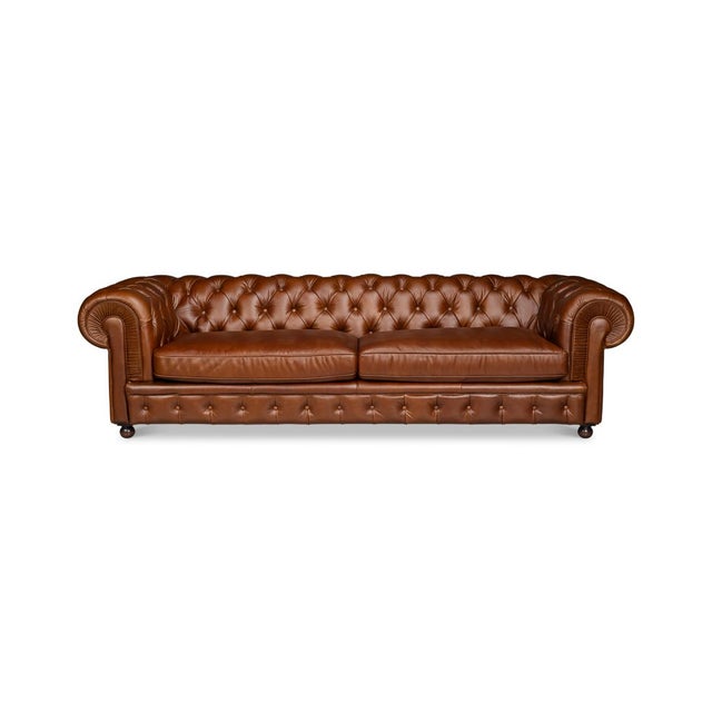 Classic British style to any room with its well-known shape and expert upholstery. With deep button tufting, rolled arms...