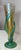 This exquisite figural glass vase is a stunning piece of art crafted by the renowned Muller. The rainbow hues of the...