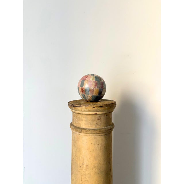 An antique wooden column with classical but minimal details and a wonderful Gustavian patinated finish. An atmospheric and...