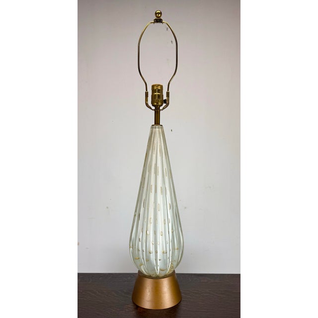 A beautiful Murano art glass table lamp attributed to Barovier & Toso circa 1950’s. Features a fluted teardrop clear glass...