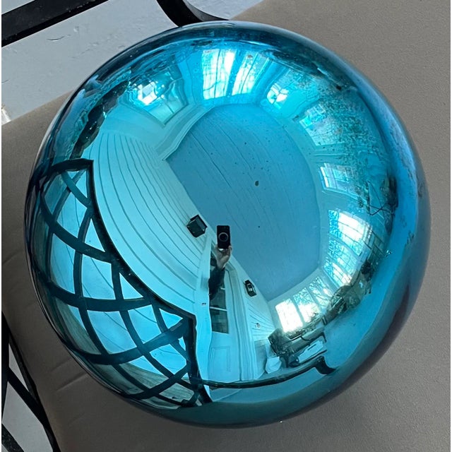 Large blue mercury glass garden gazing sphere or witch's ball. Measures 11" diameter with a 3" stem. This dates from the...