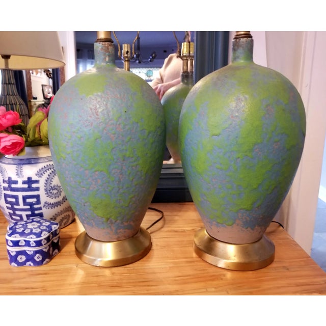 Stunning pair of pottery lamps presented in a sky blue and kelly green textured glaze over a grey earthenware. Round bold...