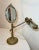 Up for sale is a very rare antique ornate Depose brass vanity mirror table lamp. The lamp has ball jointed arms that allow...
