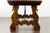 An Italian low fratino walnut table from the early 19th century, with wrought iron stretchers. Created in Italy during the...