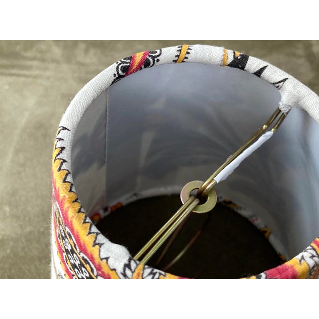 A clip top chandelier shade handmade from a circa 1880s French printed cotton. Measurements: top 3” side 4” bottom 4”