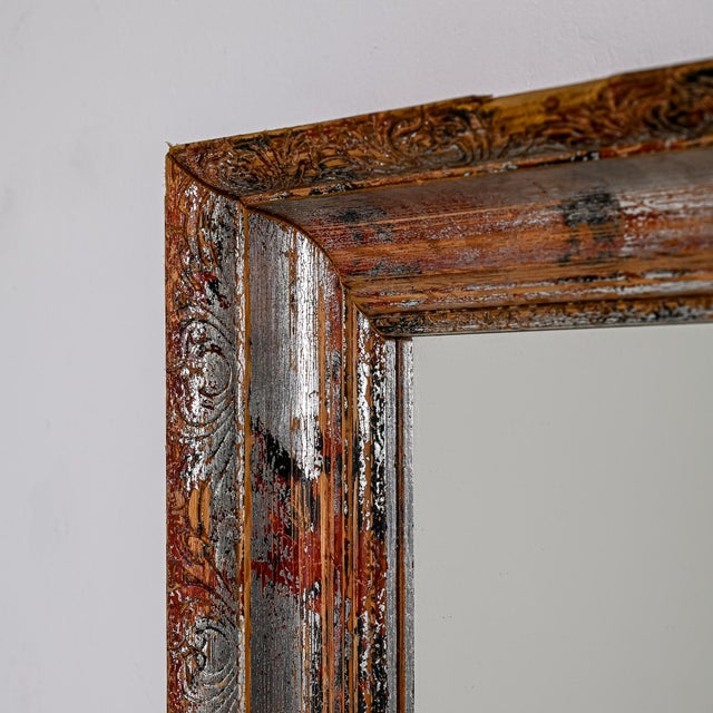 Immerse your space in the nostalgic elegance of this 1920s French Wood Patinated Mirror. The ravages of time have bestowed...