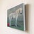 Abstract Dissolution by Shelli Langdale | Oil on gallery canvas of a white horse beside a red ball For Sale - Image 3 of 4
