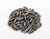 Ai Wei Wei (Chinese, b. 1957) "Kui Hua Zi" Trompe L'Oeil Porcelain Sunflower Seeds in a Two-Piece Glass Vase. Overall:...