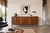 A beautifully vintage walnut credenza designed by Bert England for John Widdicomb as part of the highly coveted...