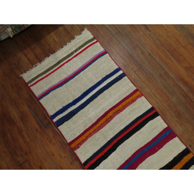 Mid-20th Century Narrow and long Vintage Turkish kilim one-of-a-kind Runner. Professionally Cleaned and able to endure...
