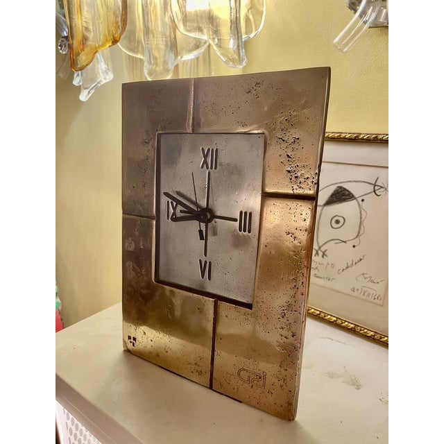 Clock sculpture in bronze and cast aluminum for the base by artist David Marshall. Marshall moved to Spain in the...