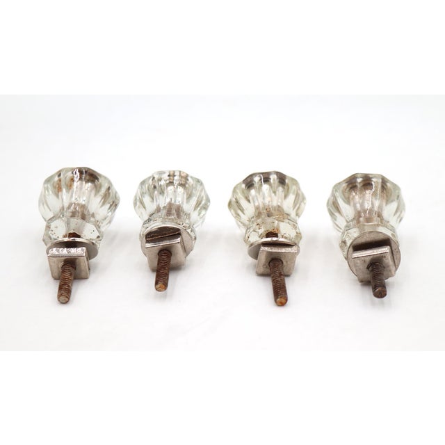 Vintage clear fluted glass cabinet or drawer pulls paired with steel screws. Mounting screws are included. Good condition...