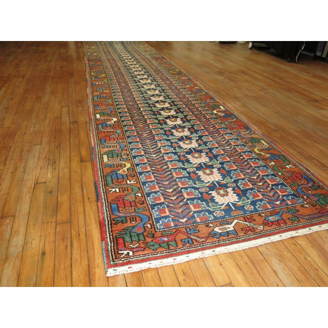 An antique Northwest Persian eclectic pattern rug from the early 20th century. Measures: 3'10'' x 17'8''.