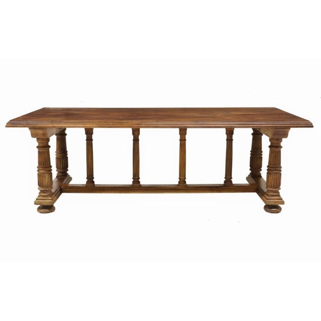 An impressive authentic antique European Neoclassical style carved walnut table. France, early 20th century, executed in...